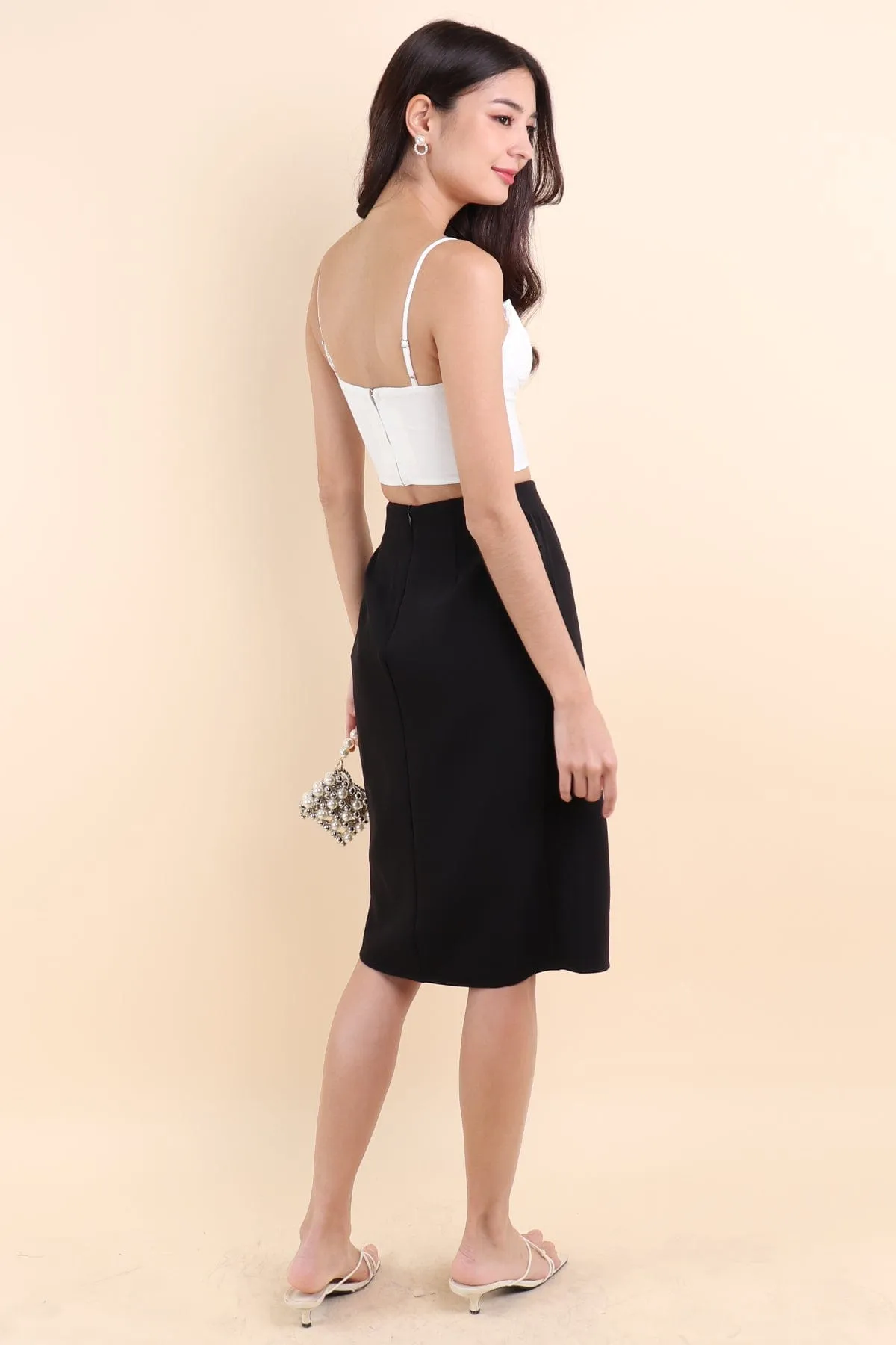 KINSLEY ASYMMETRICAL MIDI SKIRT IN BLACK